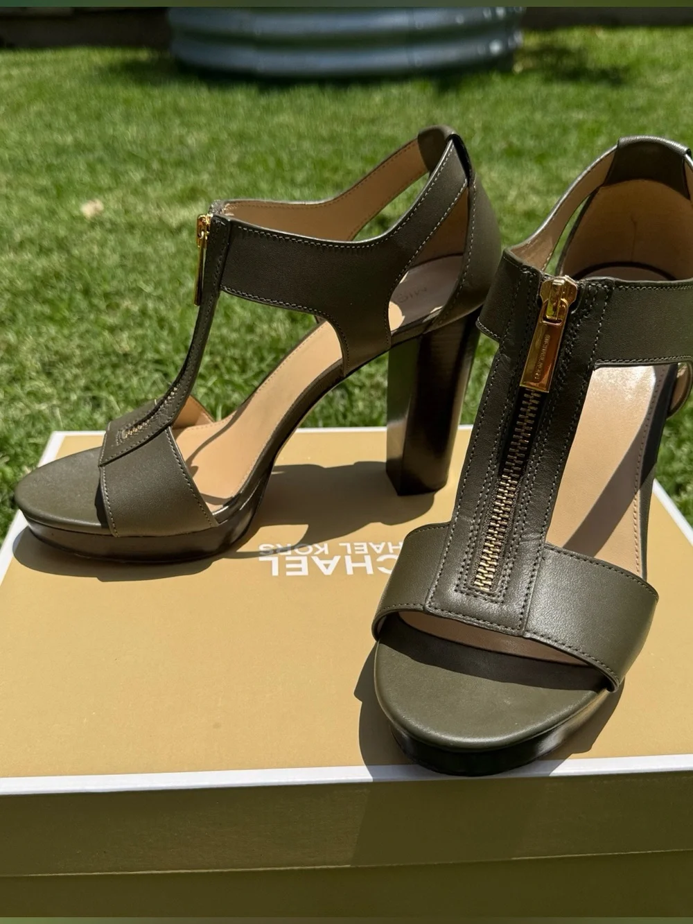 MICHAEL Michael Kors Olive Green T‑Strap Stacked Heel with Gold Zip Detail